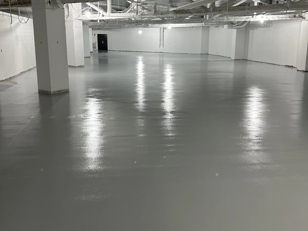 The same commercial space with a solid gray high gloss floor coating