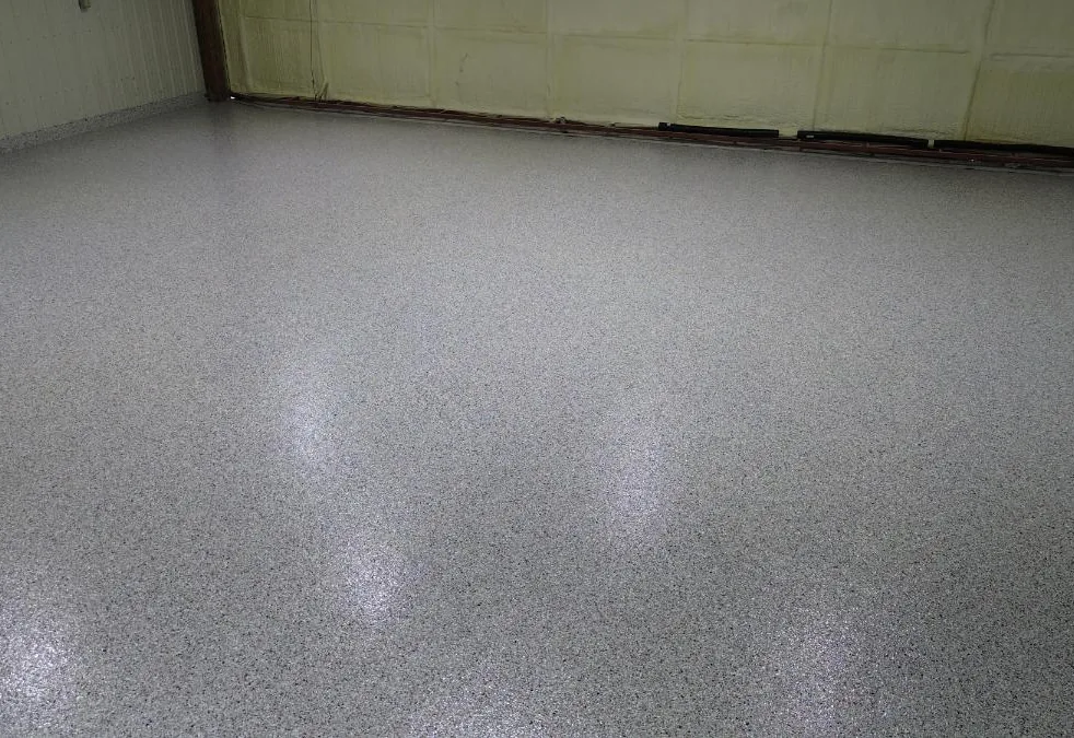 Finished light flake floor coating in a pole building shop