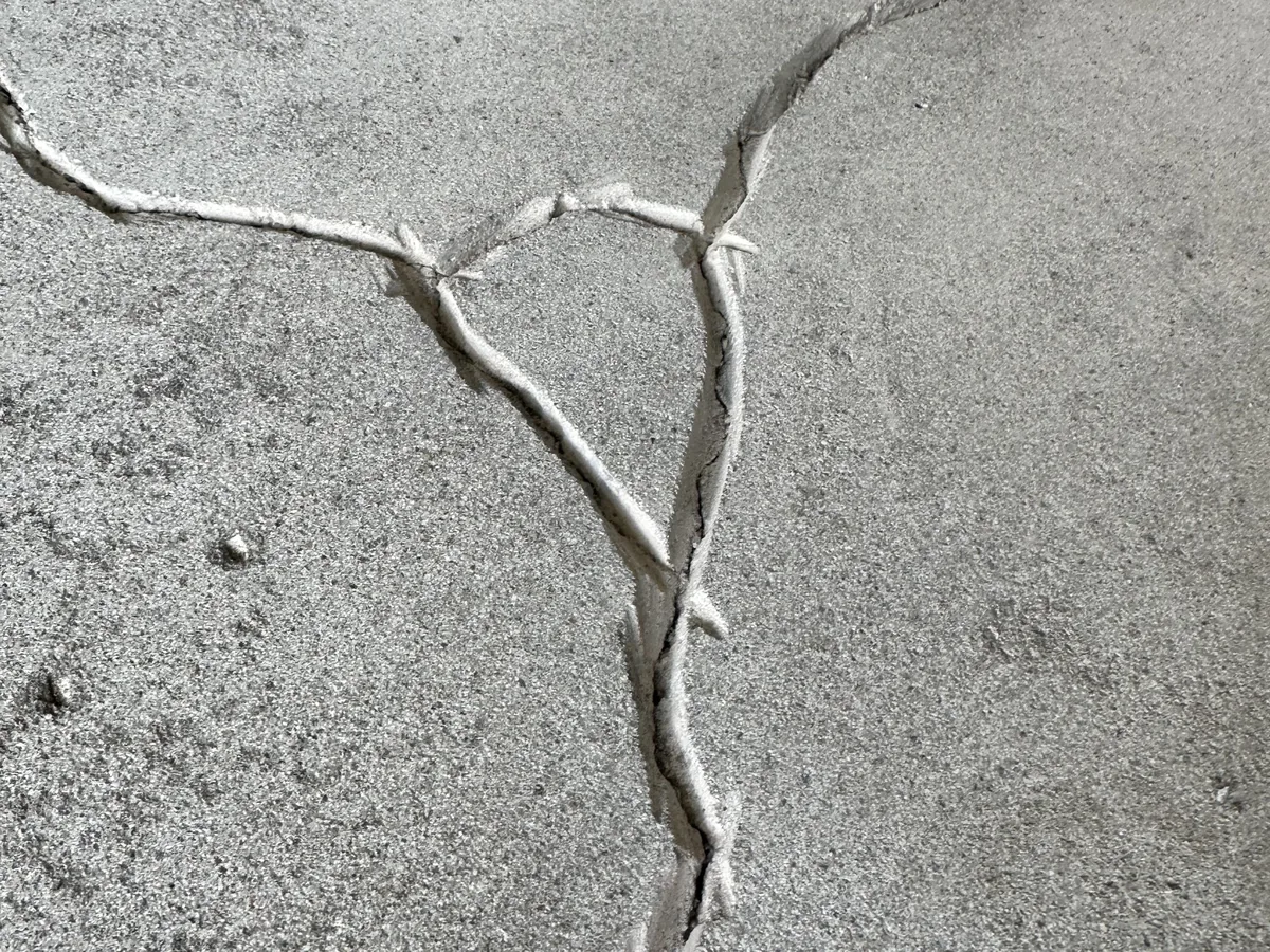 Branching open cracks in a concrete floor