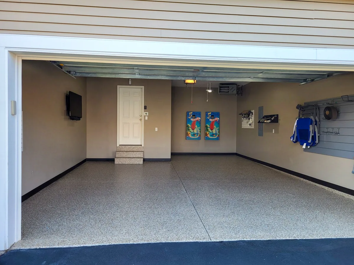 Tan and gray flake garage floor seen from the driveway