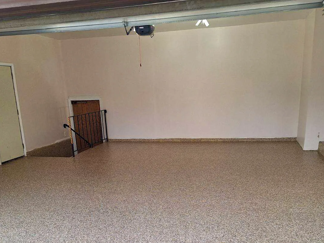 The same garage with a tan and brown flake floor coating