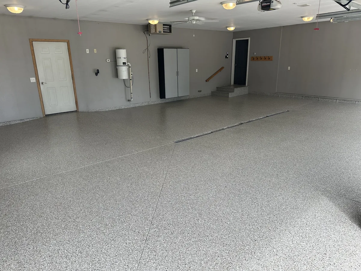The same large garage with a light gray flake floor coating