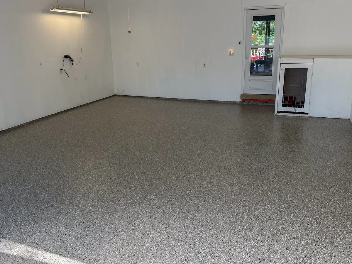 The same garage with a new gray and tan flake floor coating