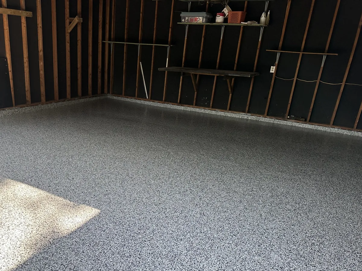 The same garage with a black, white and gray flake floor coating