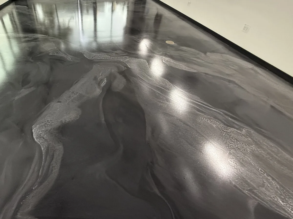 Charcoal metallic epoxy floor with light reflections