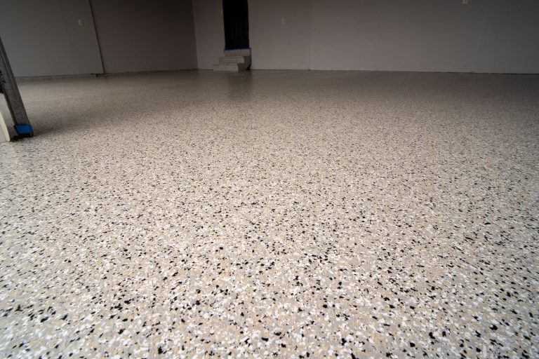 Finished garage floor with cabin fever flake and polyaspartic